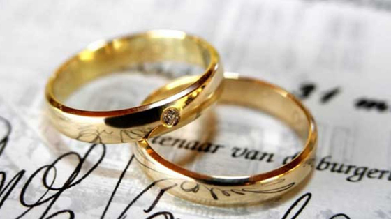 rings on wedding booklet